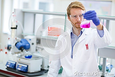 Chemical technician checking liquid reagent Stock Photo