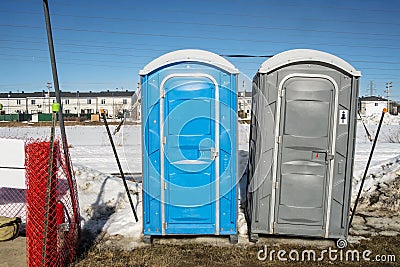 Chemical toilet on a construction site Stock Photo