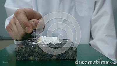 Chemist or medical research scientist adds fire to a violent chemical reaction. Chemical experience Stock Photo