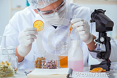 The chemist mixing perfumes in the lab Stock Photo