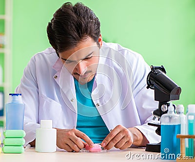 Chemist testing soap in the lab Stock Photo