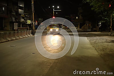 Chennai, India-May 01 2020: Delivery van drives at night in a city Editorial Stock Photo