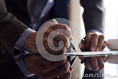 Businessman sign cheque Stock Photo
