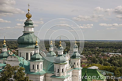 Chernigov, Ukraine. August 15, 2017. Christian orthodox white church with green domes and gold crosses. View from high. Calm sky Stock Photo