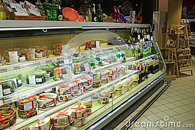 Cakes on the shelves of supermarket. Shop for sweet tooth Editorial Stock Photo