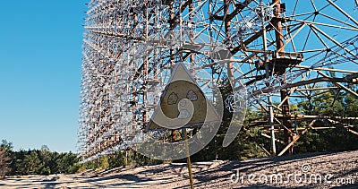 Chernobyl, radiation sign near the military radar Dug. Giant antenna of the cold war of the USSR. Ukraine. Stock Photo