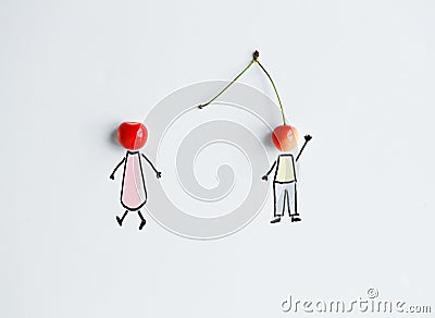 Cherries with hand drawing shapes of loving couple Stock Photo