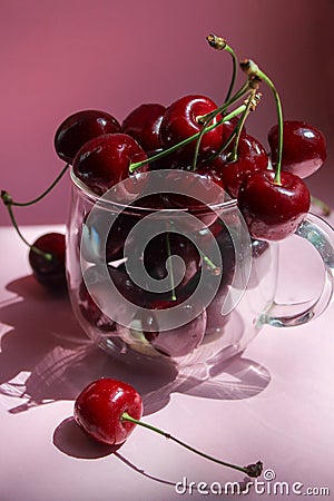 Cherries in transparent bowl, pink background. Red cherry. Fresh cherries. healthy food concept Stock Photo