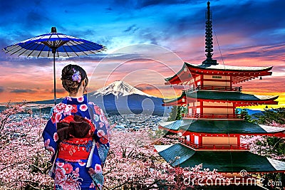 Cherry blossoms in spring, Asian woman wearing japanese traditional kimono at Chureito pagoda and Fuji mountain at sunset in Japan Stock Photo