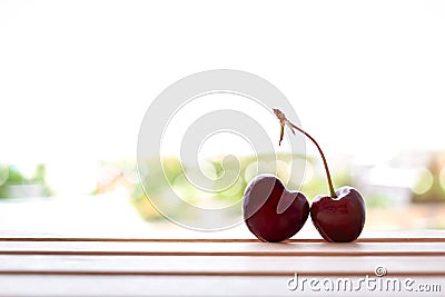 Cherry fruit Heart shapes on wooden table heart shaped from ripe fresh Cherries. Love and valentine day form food concept Stock Photo