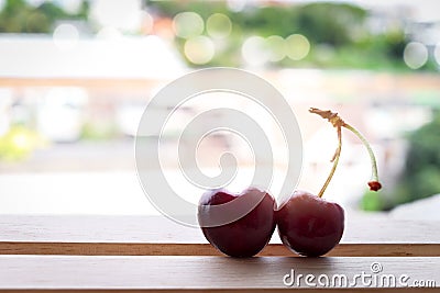 Cherry fruit Heart shapes on wooden table heart shaped from ripe fresh Cherries. Love and valentine day form food concept Stock Photo