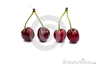 Cherry isolated on white with clipping path. Four cherries with stems. Ripe cherry isolated. Sherry berry fruit isolated Stock Photo
