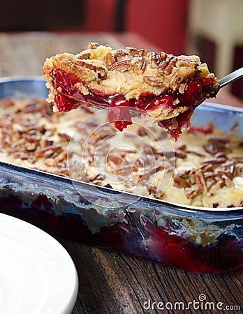 Cherry Pecan Dump Cake Serving on a Spoon Stock Photo