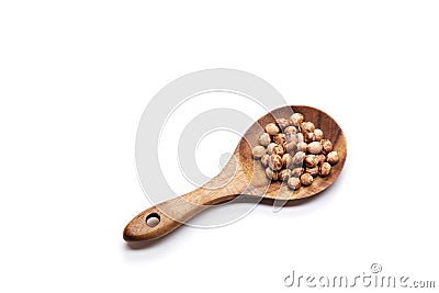 Cherry seeds in spoon on white background Stock Photo