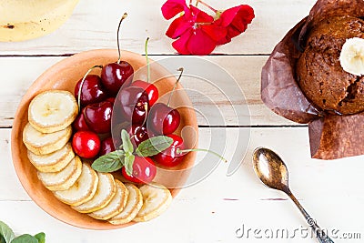 Cherry and sliced banana on a plate. Stock Photo