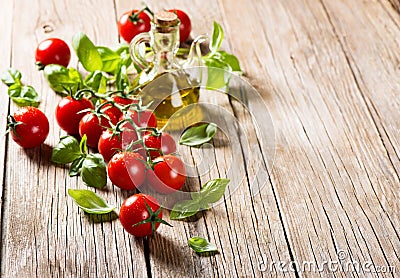 Cherry tomatoes with basil and olive oil Stock Photo