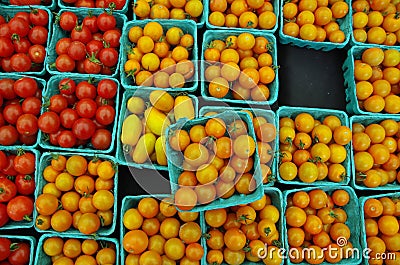 Cherry tomatoes in green containers Stock Photo