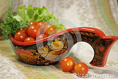 Cherry tomatoes with parsley in Hohloma Stock Photo