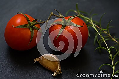 Cherry tomatoes and rosemary, garlic Stock Photo