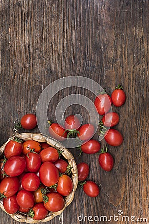 Cherry tomatoes ,is a small tomatos on wood top and Basket weave Stock Photo