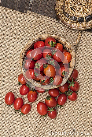 Cherry tomatoes ,is a small tomatos on wood top and Basket weave Stock Photo