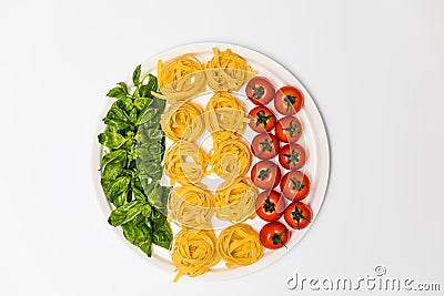 Cherry tomatoes, spaghetti and fresh basil on a platter on a white background Stock Photo