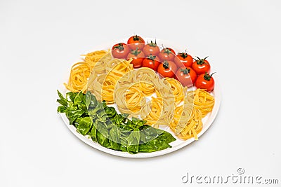 Cherry tomatoes, spaghetti and fresh basil on a platter on a white background Stock Photo