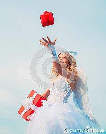 Cherub angel girl teen with gift for your. Child with angelic character. Happy Valentines day. Stock Photo