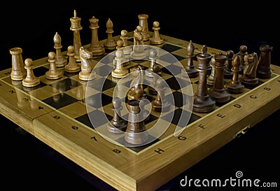 Chess. Chess board on a black background. Stock Photo