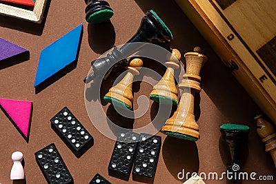 Chess board and chess pieces. desktop games, on the brown table. Home entertaiment, indoor games. Stock Photo