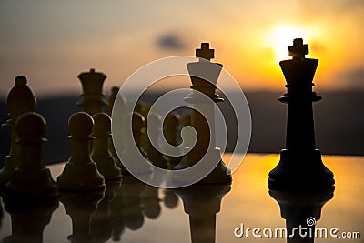 chess board game concept of business ideas and competition and strategy ideas. Chess figures on a chessboard outdoor sunset backgr Stock Photo