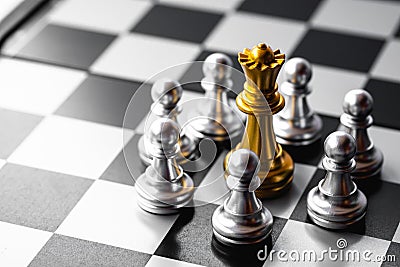 Chess board game. Queen is in trouble been surrounded by enemies. Business strategy and competition Stock Photo