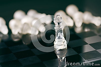 Chess business concept of victory. Chess figures in a reflection of chessboard. Game. Competition and intelligence concept. Stock Photo