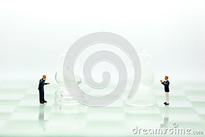 Chess business with miniature people : businessman idea for com Stock Photo