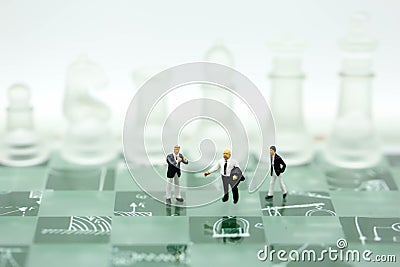 Chess business with miniature people : businessman idea for com Stock Photo