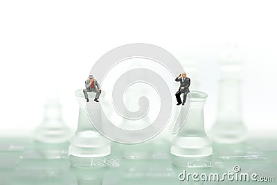 Chess business with miniature people : businessman idea for com Stock Photo