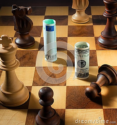 Chess with the dollar and euro bank note. Dollar Stock Photo