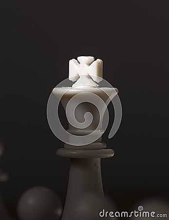 Chess figure king with light on crown. White chess king. Chessmate victory concept photo Stock Photo