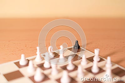 Chess pieces as metaphor - racism and bullying Stock Photo