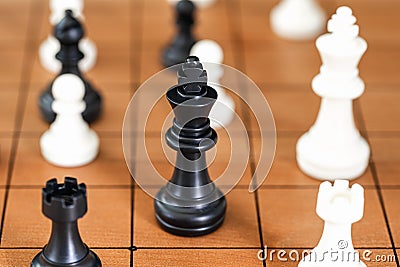 Chess pieces on wood chessboard Stock Photo