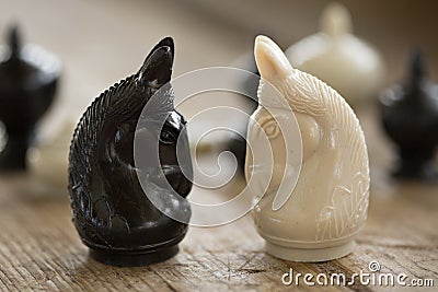 Chess pieces on wooden table, Planing game. chess uniqueness concept on the wooden background Stock Photo