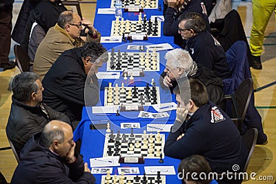 Chess players during gameplay at a local tournament Editorial Stock Photo