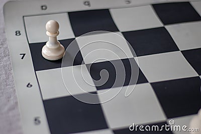 Chess promotion, pawn almost promoted. Stock Photo