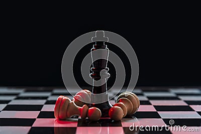 Chess queen defeats a batch of white pawns on a chessboard Stock Photo
