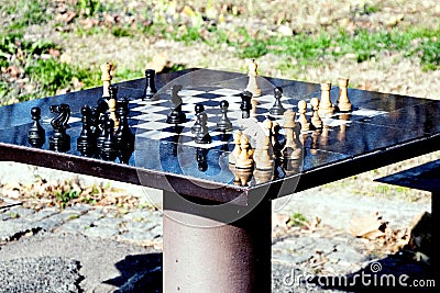 Chess table and chessman in the park, for active seniors Stock Photo