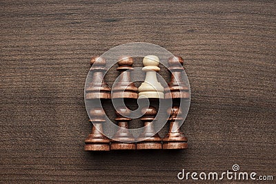 Chess uniqueness concept on wooden background Stock Photo