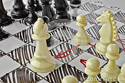 Chess. The white Bishop is under attack. Stock Photo