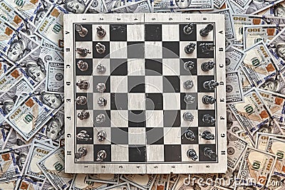 Chessboard against the background of money, strategy concept Stock Photo