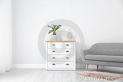 Chest of drawers in stylish living room Stock Photo