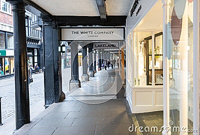 CHESTER, ENGLAND - MARCH 8TH, 2019: A view of highstreet shops in the Rows, Chester Editorial Stock Photo